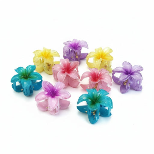 Colorful flower-shaped hair clips on a book with 'Delta' branding.