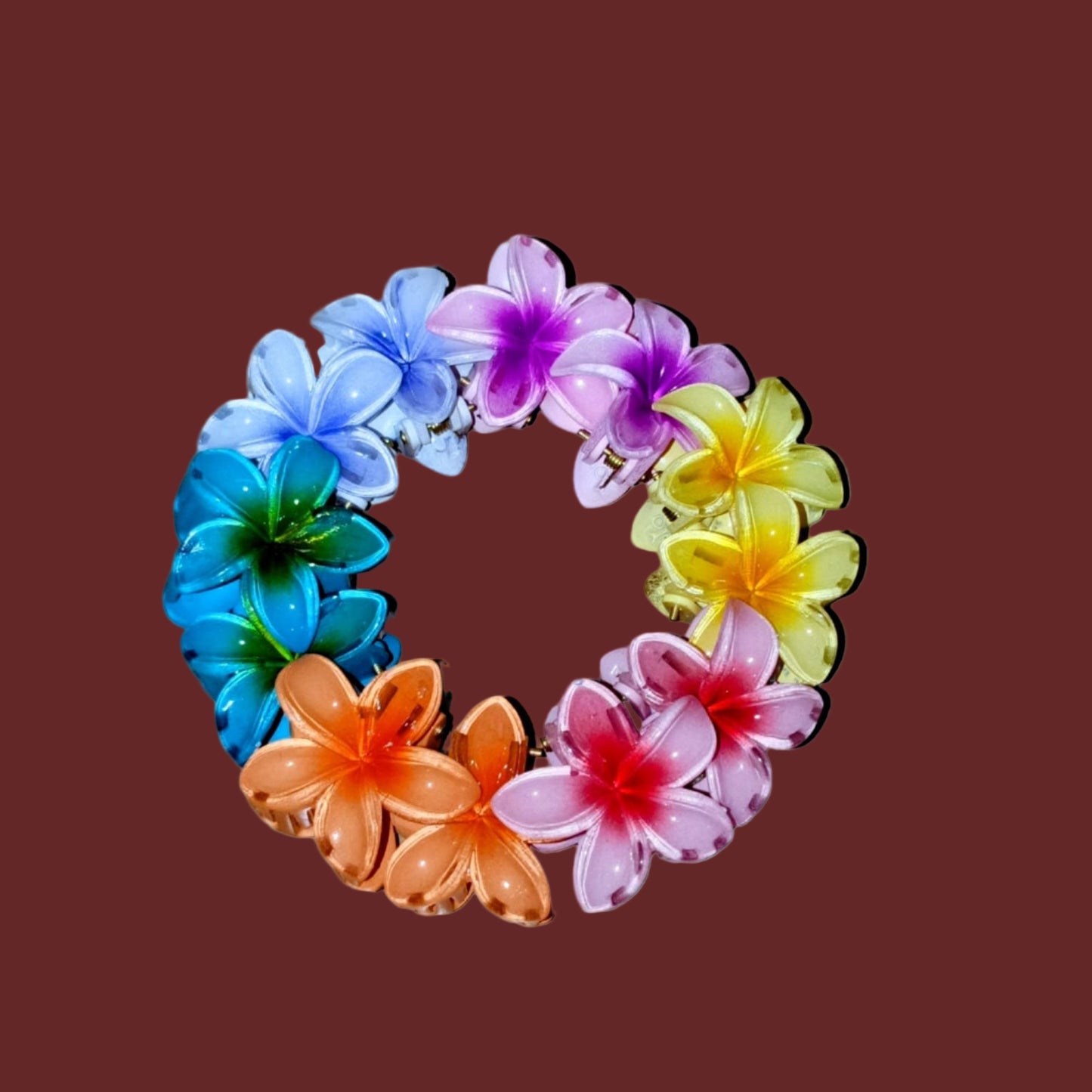 Colorful flower-shaped hair clips on a wooden surface