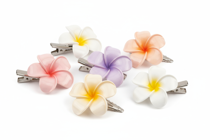 Add a touch of floral elegance to your hairstyle with this set of 5 plumeria-inspired hair clips. Crafted with a glossy finish and soft pastel tones, these clips are perfect for daily wear, festive styling, or gifting. Each clip offers a strong grip and a lightweight feel, making them both stylish and practical.
